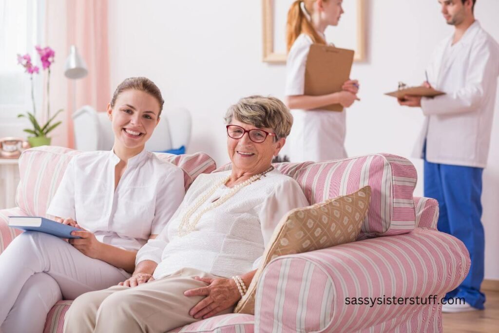 elderly woman and young adult family member siting together at assisted living facility with doctor and nurse in background.