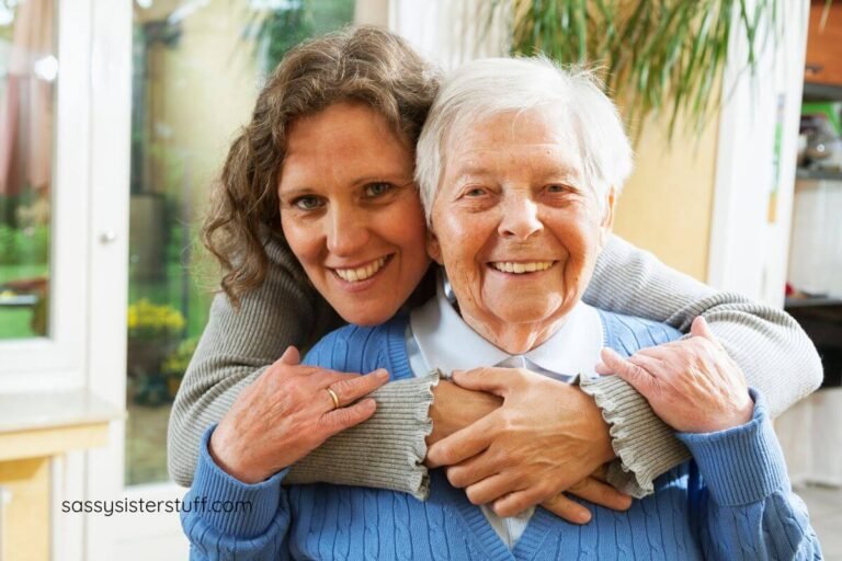 adult daughter gives her mother a big hug as they smile for the camera.