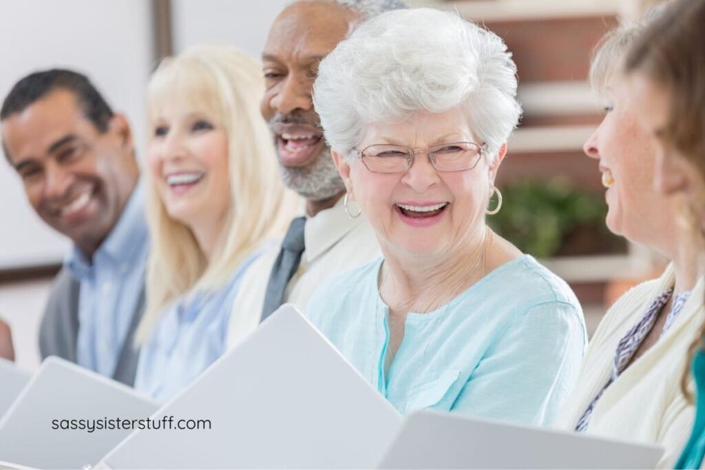 happy senior citizens laughing at a fun presentation in their senior living facility.