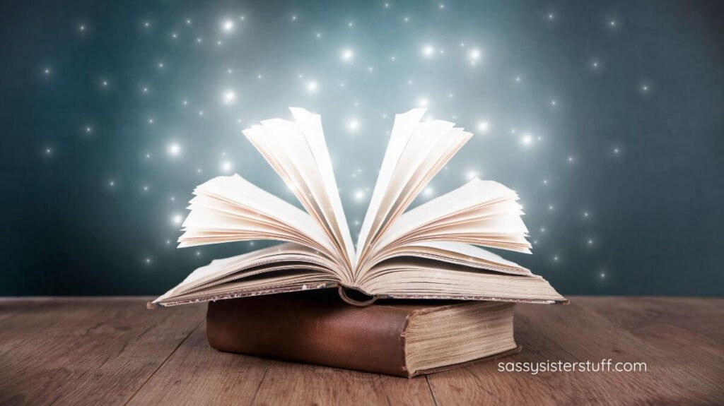an open book with sparkles coming out of it for inspiration.