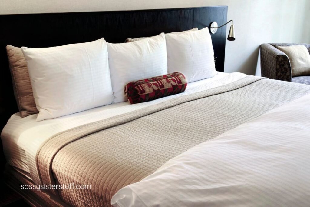 remodeled bed with quality sheets and new lighting for elderly parents.