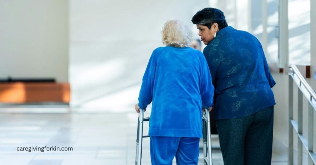 an adult woman walks down a hallway with her older mother who is using a walker.