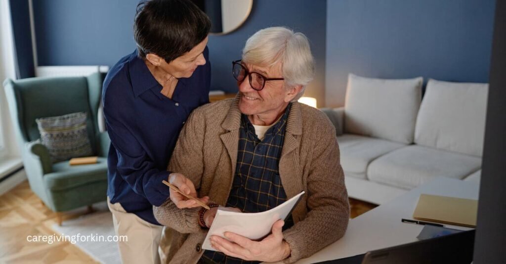 elderly husband and wife looking over some paperwork that needs to be completed together.