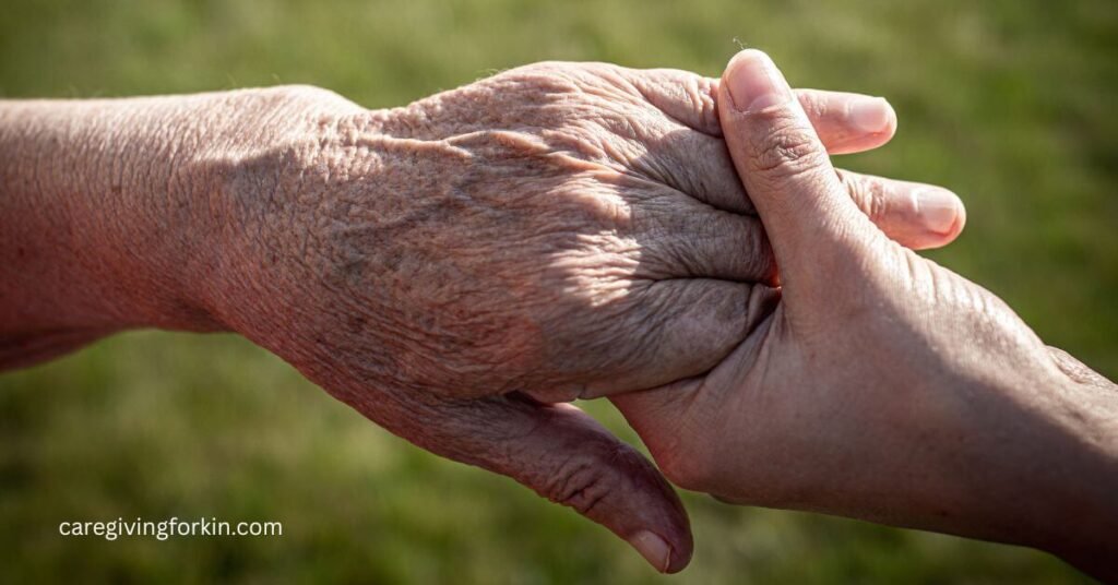 closeup of two holding hands... one elderly and one younger.